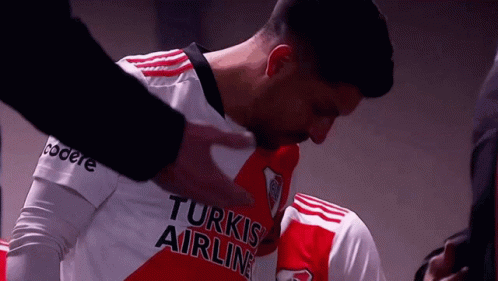 A Man In A Turkish Airlines Jersey Is Being Comforted GIF
