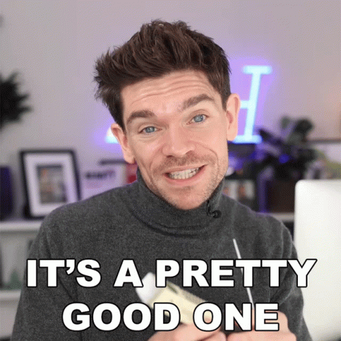 A Man In A Turtleneck Sweater Is Smiling With The Words It 'S A Pretty Good One Above Him GIF