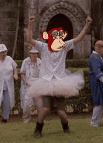 A Man In A Tutu With A Monkey Face On His Face GIF
