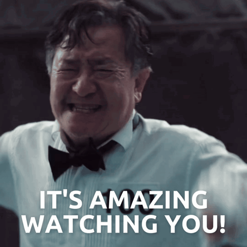A Man In A Tuxedo And Bow Tie Crying With The Words It 'S Amazing Watching You Behind Him GIF