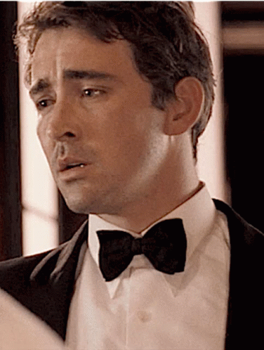 a man in a tuxedo and bow tie