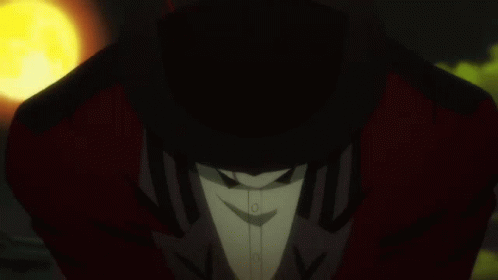 A Man In A Tuxedo And Bow Tie Holds A Yellow Object In His Hand GIF