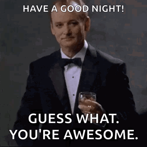 A Man In A Tuxedo And Bow Tie Is Holding A Glass Of Whiskey . GIF