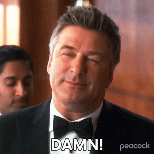 A Man In A Tuxedo And Bow Tie Is Making A Funny Face And Saying Damn . GIF