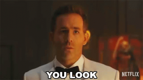 A Man In A Tuxedo And Bow Tie Is Making A Surprised Face And Says `` You Look '' . GIF