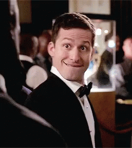 Man In Tuxedo Making A Face Smiling GIF
