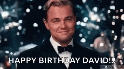 A Man In A Tuxedo And Bow Tie Is Smiling And Saying `` Happy Birthday David ! '' GIF