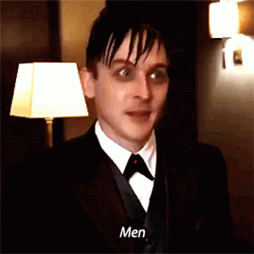 A Man In A Tuxedo And Tie Says Men GIF