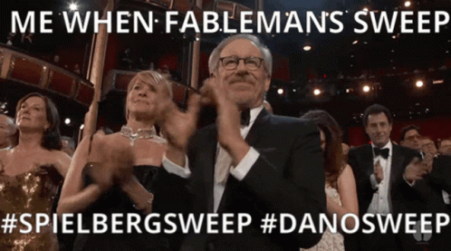 A Man In A Tuxedo Applauds At An Awards Show GIF