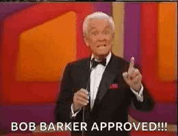 A Man In A Tuxedo Is Giving A Thumbs Up Sign . GIF