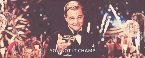 A Man In A Tuxedo Is Holding A Glass Of Champagne With The Words " You Got It Champ " Below Him GIF