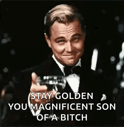 A Man In A Tuxedo Is Holding A Glass Of Wine And Toasting . GIF