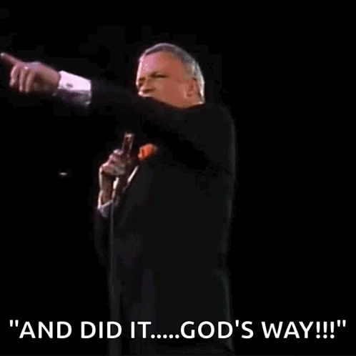 A Man In A Tuxedo Is Holding A Microphone And Saying " And Did It ... God 'S Way " GIF