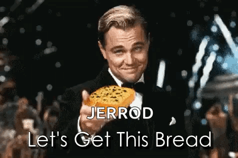 A Man In A Tuxedo Is Holding A Piece Of Bread With The Words Let 'S Get This Bread Below Him GIF