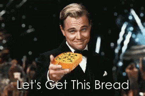 A Man In A Tuxedo Is Holding A Slice Of Bread And Says " Let 'S Get This Bread " GIF