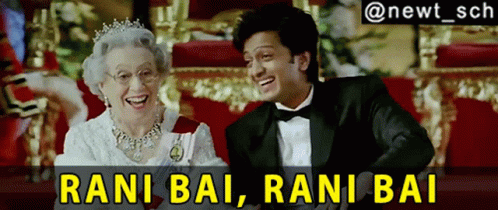A Man In A Tuxedo Is Laughing Next To An Elderly Woman With The Caption Rani Bai Rani Bai GIF