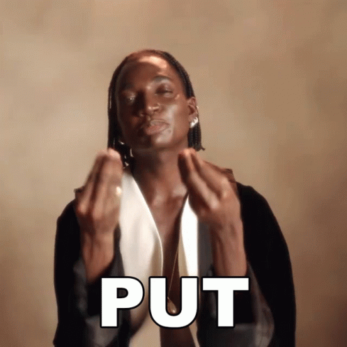 A Man In A Tuxedo Is Making A Gesture That Says " Put " GIF