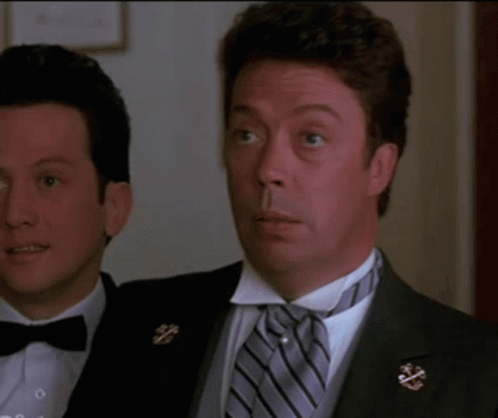 A Man In A Tuxedo Is Smiling And Says I Love You GIF
