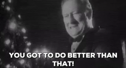 A Man In A Tuxedo Is Smiling In Front Of A Christmas Tree And The Words `` You Got To Do Better Than That '' . GIF