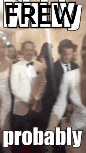 A Man In A Tuxedo Is Standing In Front Of A Sign That Says Brew Probably GIF
