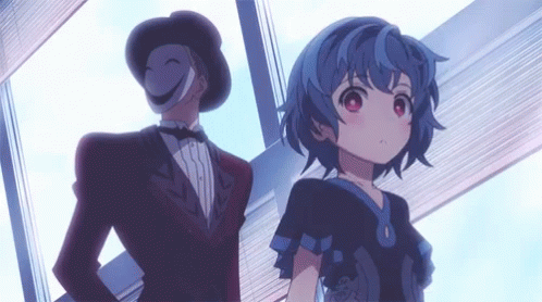 A Man In A Tuxedo Is Standing Next To A Girl With Blue Hair . GIF