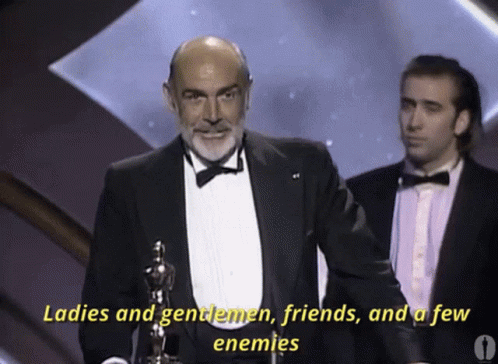 A Man In A Tuxedo Is Talking About Ladies And Gentlemen GIF
