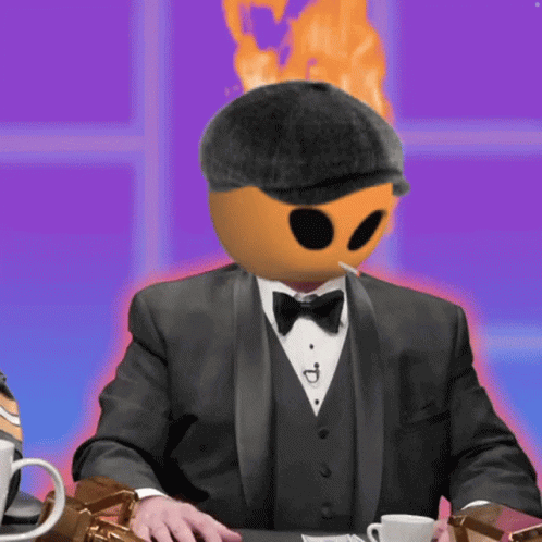 A Man In A Tuxedo Smoking A Cigarette With A Fireball On His Head GIF