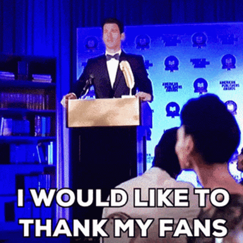 A Man In A Tuxedo Stands At A Podium Giving A Speech And Says I Would Like To Thank My Fans GIF