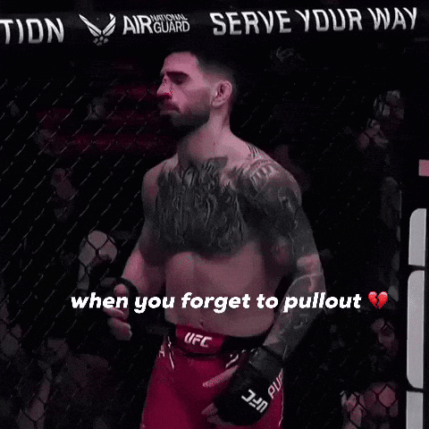 A Man In A Ufc Belt Stands In Front Of A Sign That Says " Serve Your Nation " GIF