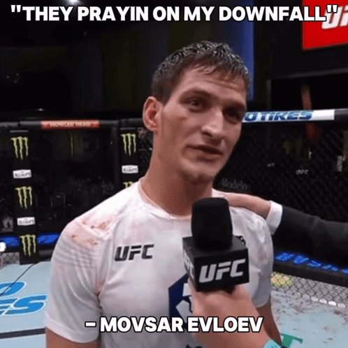 a man in a ufc shirt is being interviewed by a ufc reporter