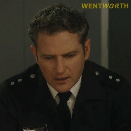 A Man In A Uniform With The Word Wentworth On The Bottom Right GIF