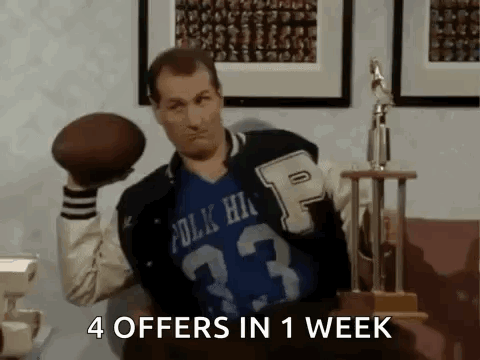 Man In Varsity Jacket Holding Football GIF