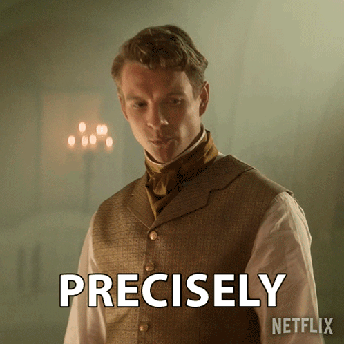 A Man In A Vest And Tie Has The Word Precisely On His Chest GIF