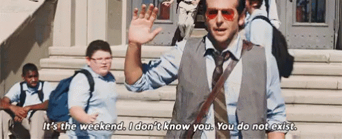 A Man In A Vest And Tie Is Waving At A Group Of Children While Standing On A Set Of Stairs . GIF