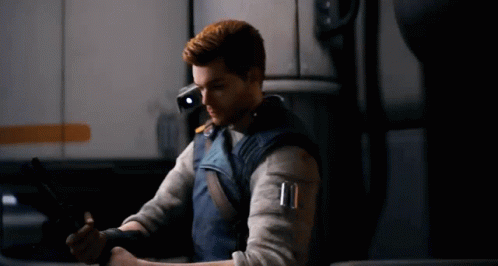A Man In A Video Game Is Holding A Gun In His Hand . GIF