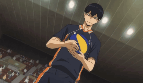 A Man In A Volleyball Uniform Holds A Yellow And Blue Ball GIF