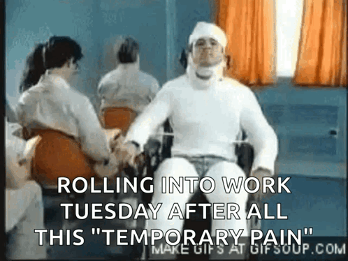 A Man In A Wheelchair Has A Bandage On His Head And Says Rolling Into Work Tuesday After All This Temporary Pain GIF