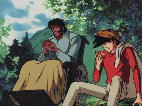 Man In Wheelchair Holding Apple Next To Boy GIF