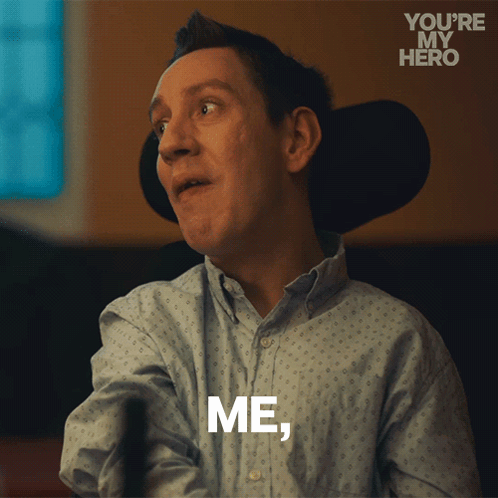 A Man In A Wheelchair Says " Me " In White Letters GIF