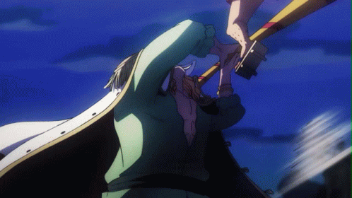 A Man In A White Cape Is Holding A Large Object In His Hand GIF