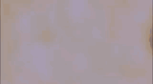 A Man In A White Coat Is Standing In A Crowd Of People . GIF