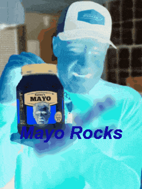A Man In A White Hat Is Holding A Jar Of Mayo With The Words Mayo Rocks Below Him GIF