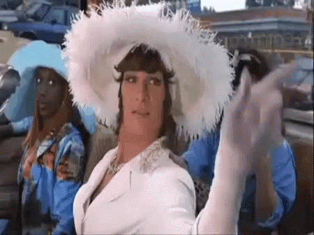 A Man In A White Hat Is Sitting In A Car With Two Women . GIF