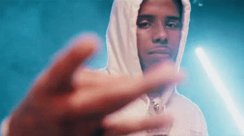 A Man In A White Hoodie Is Giving The Middle Finger . GIF