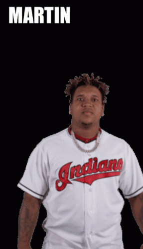 A Man In A White Indians Jersey Stands In Front Of A Black Background With The Name Martin Above Him GIF
