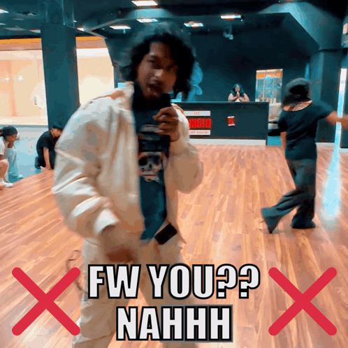 A Man In A White Jacket Is Dancing In Front Of A Sign That Says Fw You ? Nahhh GIF