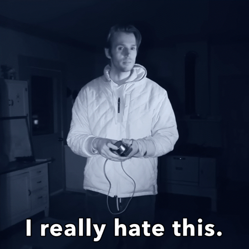 A Man In A White Jacket Is Holding A Video Game Controller And The Words I Really Hate This Are Below Him GIF