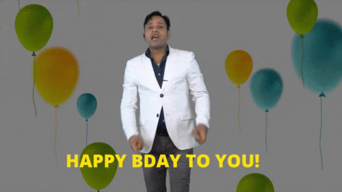 A Man In A White Jacket Says " Happy Bday To You " In Front Of Balloons GIF