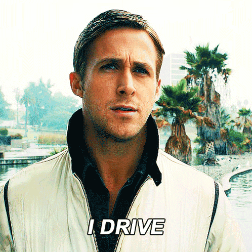 A Man In A White Jacket Says I Drive In Front Of Palm Trees GIF