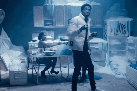 A Man In A White Jacket With The Letter R On It Stands In A Kitchen GIF